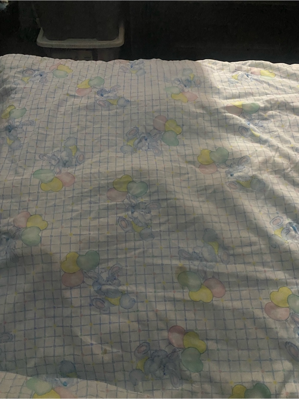 Vintage blue bunnies holding pastel balloon blanket